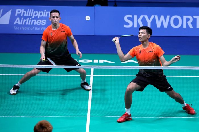 Pasangan ganda putra Indonesia, Fajar Alfian/Muhammad Rian Ardianto, pada partai kedua beregu SEA Games 2019 melawan Malaysia di Muntinlupa Sports Center, Rabu (4/12/2019).