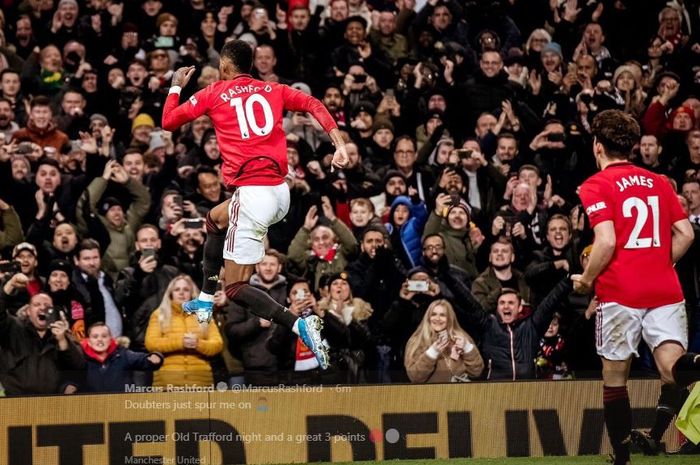 Marcus Rashford melakukan selebrasi usai mencetak gol untuk Manchester United.