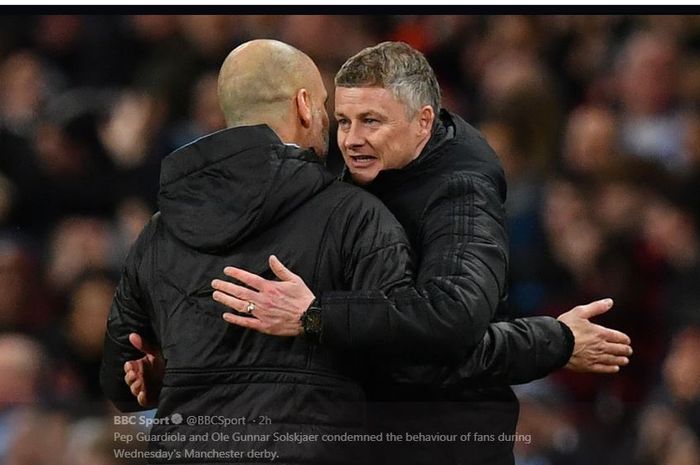 Ole Gunnar Solskjaer dan Pep Guardiola berpelukan.