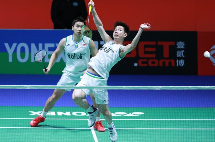 Pasangan ganda putra Indonesia, Marcus Fernaldi Gideon/Kevin Sanjaya Sukamuljo, pada perempat final All England Open 2020 di Arena Birmingham, Inggris, Jumat (13/3/2020).