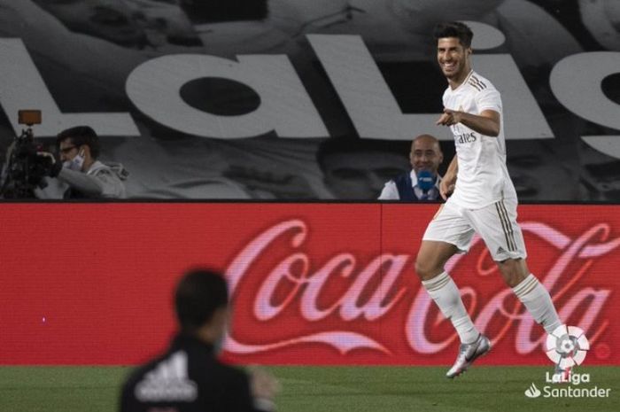 Penyerang Real Madrid, Marco Asensio, merayakan golnya ke gawang Valencia dalam laga di Stadion Alfredo Di Stefano, Kamis (18/6/2020).