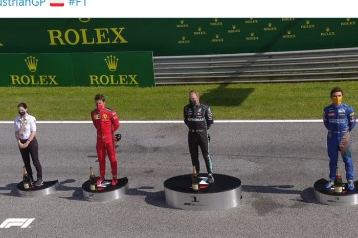 Penampakan podium F1 GP Austria di Red Bull Ring, Austria, 5 Juli 2020. Pembalap Mercedes, Valtteri Bottas (hitam), menjadi pemenang balapan diikuti Charles Leclerc (Ferrari/merah) dan Lando Norris (McLaren/biru). 