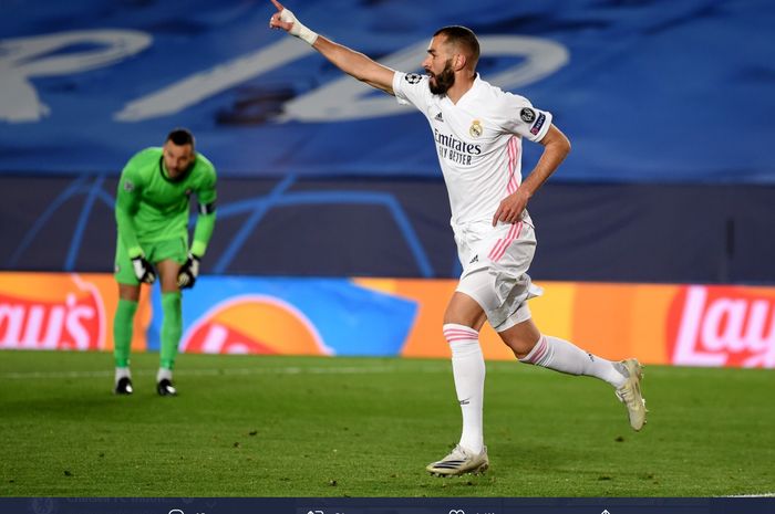 Karim Benzema melakukan selebrasi usai membobol gawang Samir Handanovic dalam kemenangan 3-2 Real Madrid atas Inter Milan pada pekan ketiga Grup B Liga Champions 2020-2021 di Stadion Alfredo Di Stefano.