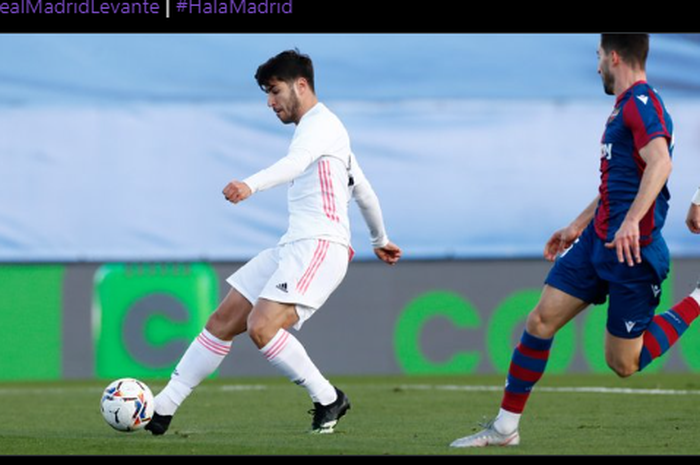 Aksi Marco Asensio saat mencetak gol pertama Real Madrid ke gawang Levante dalam laga pekan ke-21 Liga Spanyol, Sabtu (30/1/2021) malam WIB.