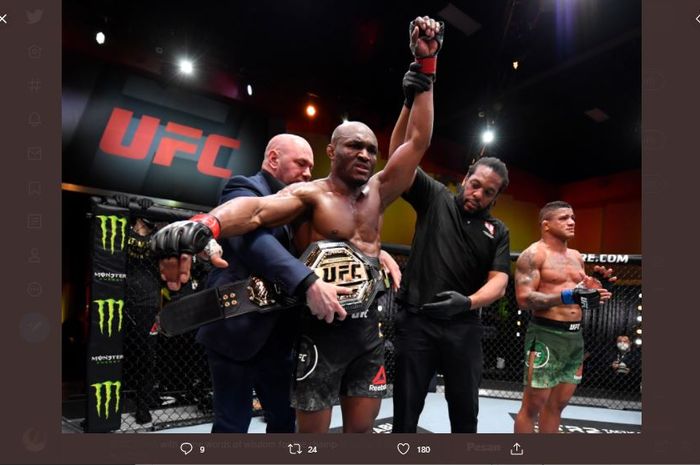 Ketika Kamaru Usman (kiri) merayakan keberhasilan mengamankan sabuk juara kelas welter UFC atas Gilbert Burns di UFC 258, Minggu (14/2/2021).