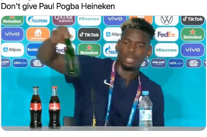 Pemain Prancis, Paul Pogba, memindahkan botol bir dari meja konferensi pers usai laga Piala Eropa 2020 kontra Jerman, Selasa (15/6/2021),