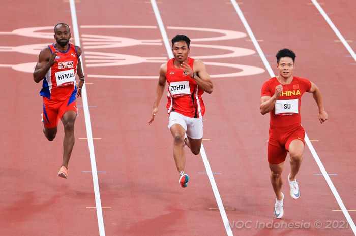 Sprinter Indonesia, Lalu Muhammad Zohri (tengah), saat tampil pada babak utama 100m putra cabang olahraga atletik, di Olympic Stadium, Tokyo, Sabtu (31/7/2021).