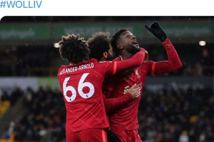 Striker Liverpool, Divock Origi, merayakan gol dalam laga Liga Inggris kontra Wolverhampton Wanderers di Stadion Molineux, Sabtu (4/12/2021).