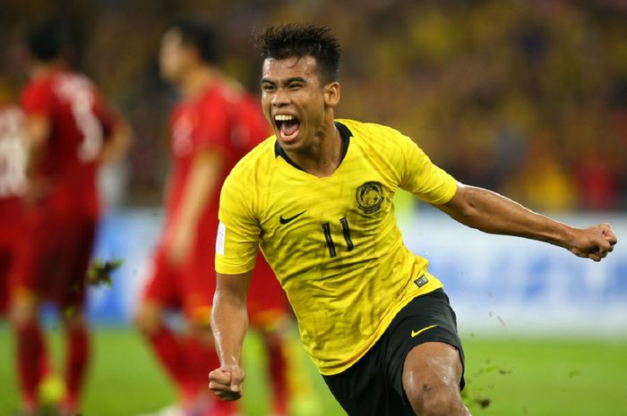 Bintang Timnas Malaysia Safawi Rasid berteriak gembira setelah membobol gawang Kamboja dalam laga perdana Grup B Piala AFF 2020 di Stadion Bishan, Singapura, Senin (6/12/2021).