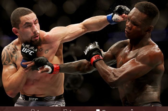 Pertandingan Israel Adesanya vs Robert Whittaker pad UFC 271, Minggu (13/2/2022).