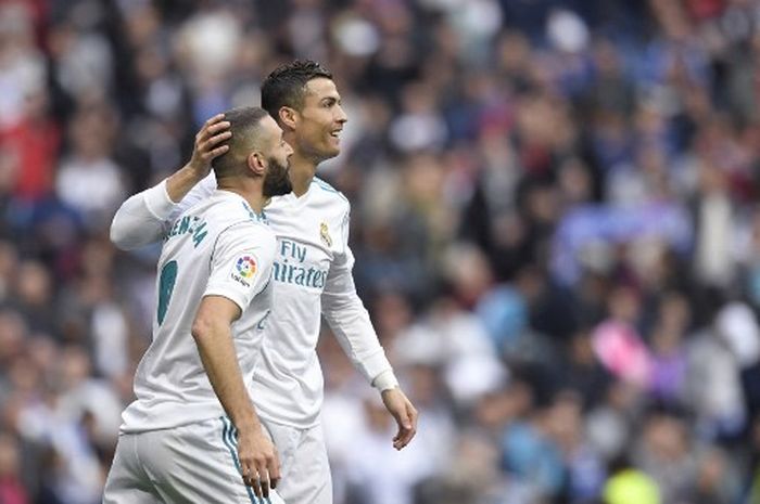 Striker Real Madrid, Karim Benzema, dalam perjalanan untuk memecahkan dua rekor gila milik Cristiano Ronaldo ketika melawan Liverpool di final Liga Champions 2021-2022.