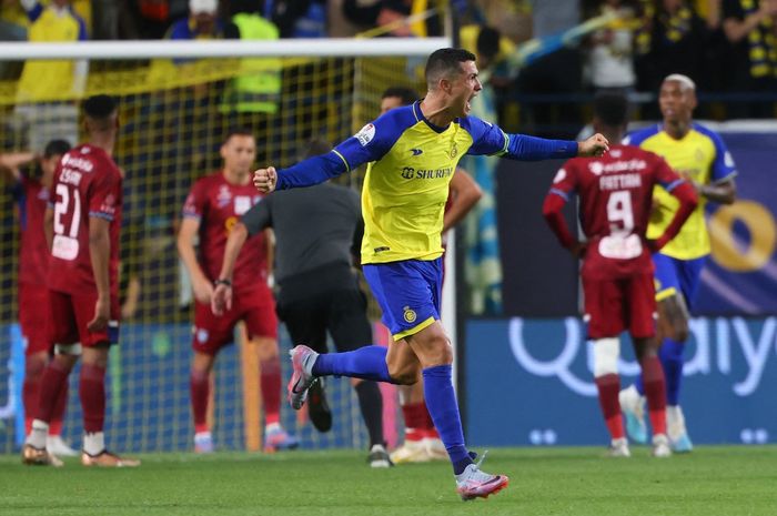 Megabintang Al Nassr, Cristiano Ronaldo, merayakan gol ke gawang Abha dalam laga di Stadion Mrsool Park, 18 Maret 2023. Ronaldo bicara soal Liga Arab Saudi posisi 4 dunia.