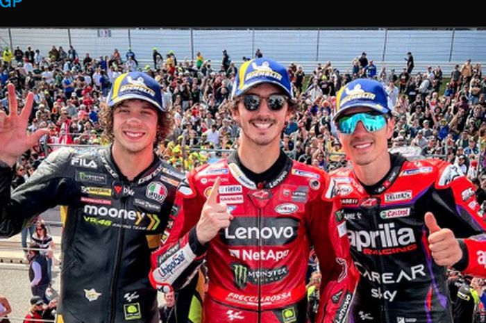 Pemilik podium MotoGP Portugal 2023, Marco Bezzechi (3), Francesco Bagnaia (1), dan Maverick Vinales (2) seusai balapan  yang digelar di Sirkuit Algarve, MInggu (26/3/2023).