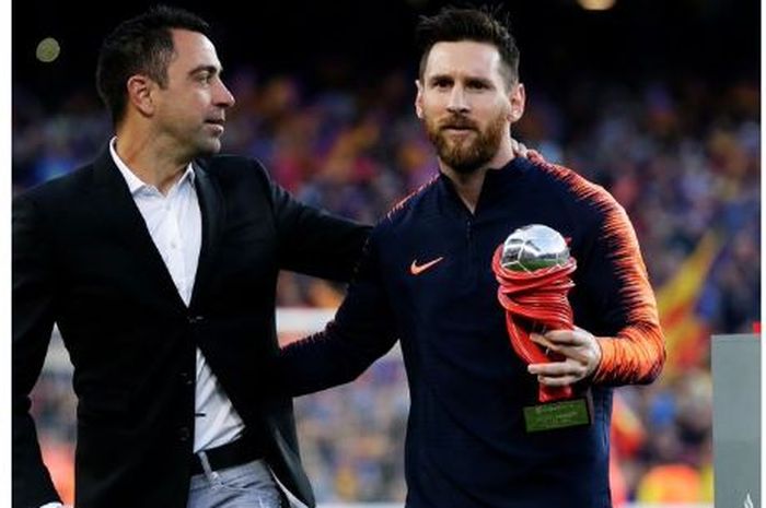 Xavi Hernandez bersama Lionel Messi