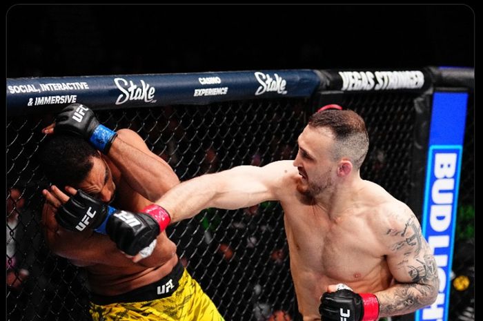 Momen Modestas Bukauskas memukul lawannya yang menjadi salah satu kemenangan cepat di UFC Seattle, Minggu (23/2/2025) waktu Indonesia.