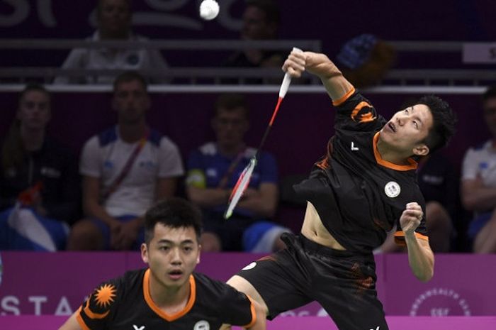   Pasangan ganda putra Malaysia, Goh V Shem/Tan Wee Kiong, tampil pada perempat final nomor beregu campuran Commonwealth Games 2018 melawan Skotlandia di Carrara Sports Arena, Gold Coast, Australia, Sabtu (7/4/2018).  