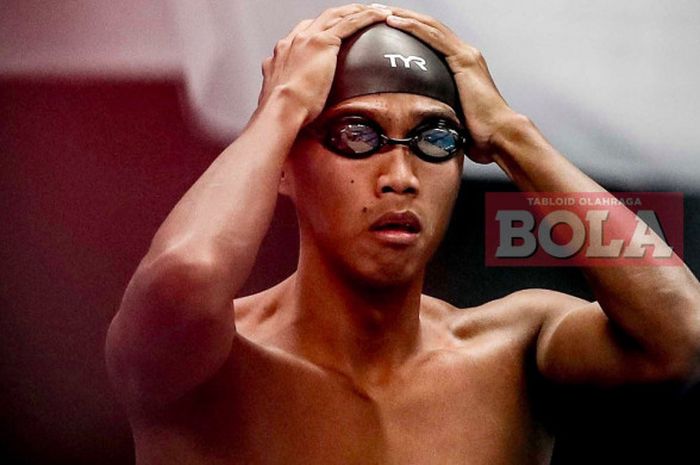 Ekspresi perenang Indonesia, Triady Fauzi Sidiq, setelah finis di urutan keenam final cabang renang nomor 200 meter gaya ganti putra di Aquatic Stadium Gelora Bung Karno, Senin (20/8/2018). 