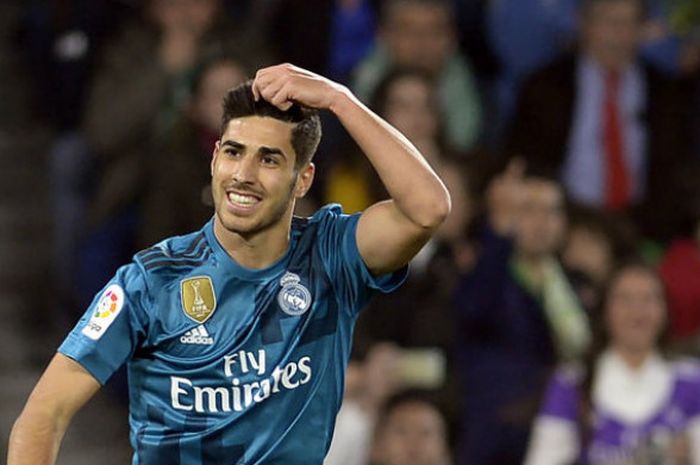 Pemain Real Madrid, Marco Asensio, merayakan gol ke gawang Real Betis pada pertandingan Liga Spanyol pekan ke-2 di Stadion Benito Villamarin, Spanyol, Senin (19/2/2018) dini hari WIB.