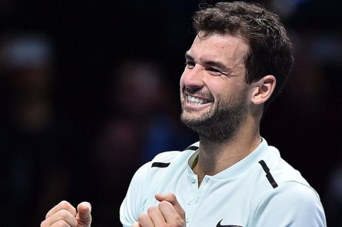 Petenis tunggal putri Bulgaria, Grigor Dimitrov, melakukan selebrasi setelah mengalahkan David Goffin (Belgia) pada laga final ATP Finals 2017, di O2 Arena, London, Minggu (19/11/2017).