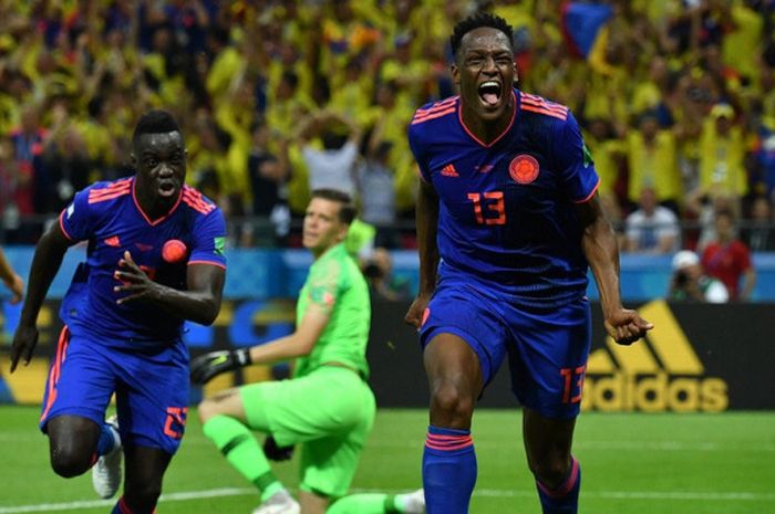 Bek Kolombia, Yerry Mina, merayakan gol yang dicetak ke gawang Polandia dalam laga Grup H Piala Dunia 2018 di Kazan Arena, Kazan, Rusia pada 24 Juni 2018.