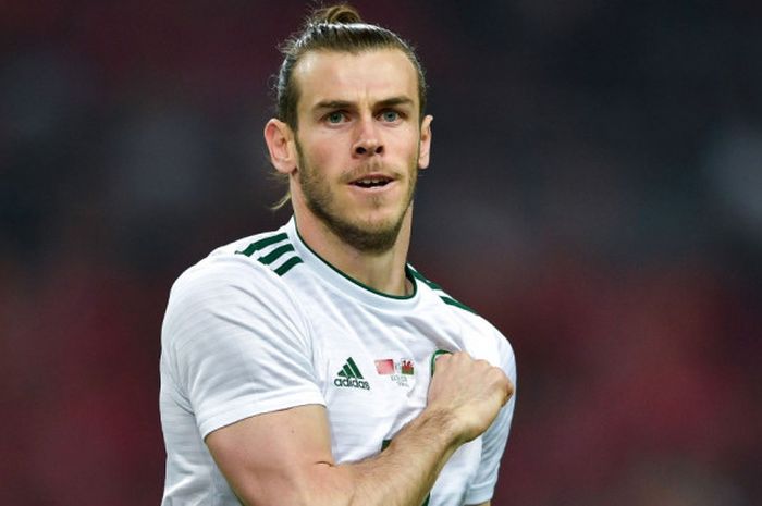 Pemain bintang Tim Nasional Wales, Gareth Bale, melakukan selebrasi setelah mencetak gol ke gawang China pada laga uji coba di Guangxi Sports Centre Stadium, China, Kamis (22/3/2018).