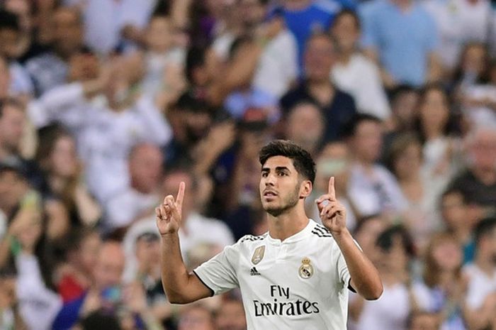 Gelandang serang Real Madrid, Marco Asensio, merayakan gol yang dicetak ke gawang Espanyol dalam laga Liga Spanyol di Stadion Santiago Bernabeu, Madrid, Spanyol pada 22 September 2018.