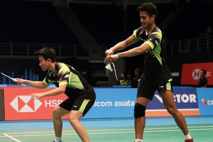 Pasangan ganda campuran nasional Indonesia, Tontowi Ahmad/Liliyana Natsir, saat melakoni laga melawan Liao Min Chun/Chen Hsiao Huan (Taiwan) pada babak kesatu Malaysia Open 2018 di Axiata Arena, Bukit Jalil, Kuala Lumpur, Malaysia, Selasa (26/6/2018).