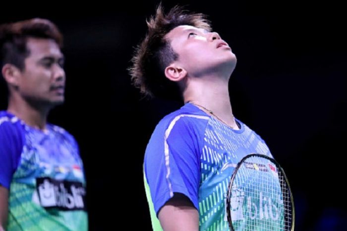 Pasangan ganda campuran Indonesia, Tontowi Ahmad/Liliyana Natsir, bereaksi dalam laga semifinal Denmark Open 2018 melawan Zheng Siwei/Huang Yaqiong (China) di Odense Sports Park, Sabtu (20/10/2018).