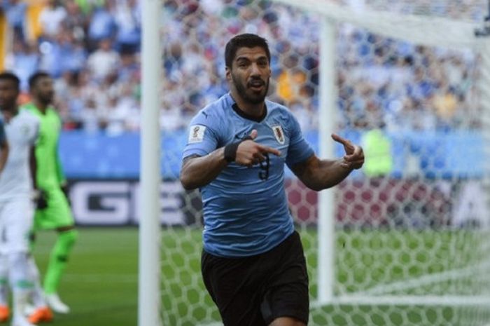 Luis Suarez merayakan golnya pada laga Uruguay vs Arab Saudi di Rostov Arena, 19 Juni 2018. 