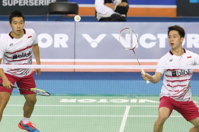 Pasangan ganda putra Indonesia, Marcus Fernaldi Gideon/Kevin Sanjaya Sukamuljo, saat menjalani pertandingan melawan wakil Malaysia, Ong Yew Sin/Teo Ee Yi, pada babak kedua turnamen Korea Terbuka  yang berlangsung di SK Handball Stadium, Seoul, Kamis (14/9/2017).