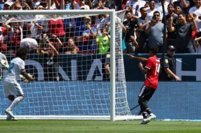 Reaksi pemain Manchester United, Jesse Lingard (berbaju merah), setelah menjebol gawang Real Madrid dalam pertandingan International Champions Cup di Levi's Stadium, Minggu (23/7/2017) waktu setempat.