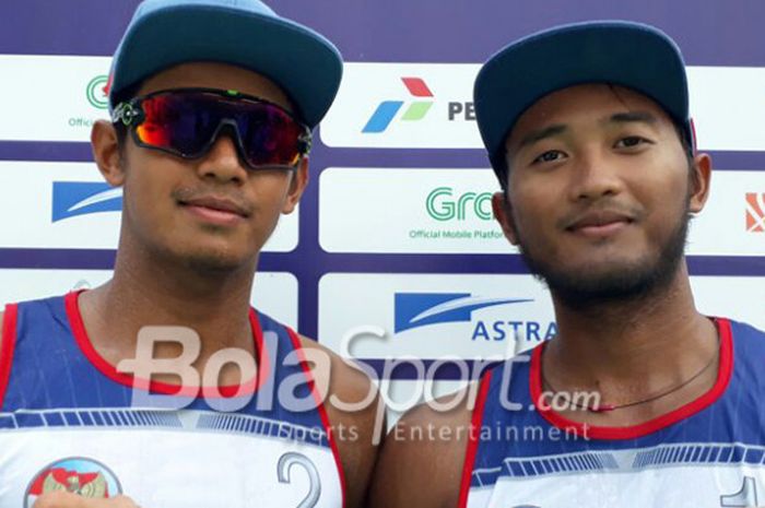 Gilang Ramadhan (kanan)/Danangsyah Yudistira Pribadi di babak penyisihan terahir nomor voli pantai putra Asian Games 2018 pada Kamis (23/8/2018).