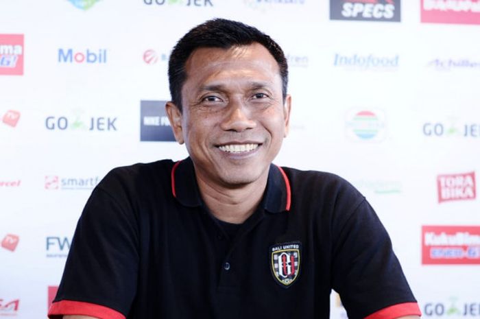  Pelatih Bali United, Widodo Cahyono Putro, melempar senyum kepada awak media di sela-sela acara temu wartawan jelang laga timnya melawan PSM, Rabu (11/7/2018). 