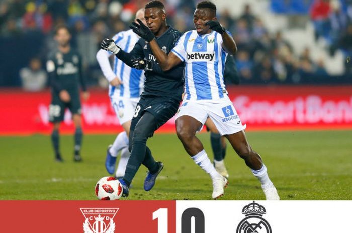 Penyerang belia Real Madrid, Vinicius Junior (kiri), berduel dengan pemain Leganes dalam partai Copa del Rey di Stadion Municipal Butarque, Madrid, 16 Januari 2019.