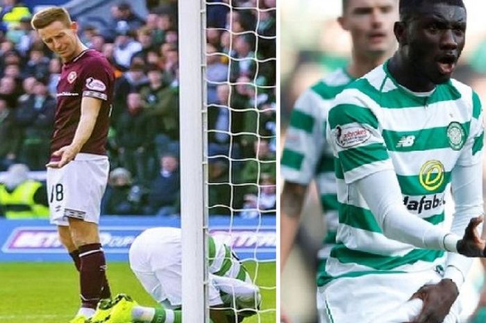 Pemain Celtic FC, Eboue Kouassi (kanan), tampak kesakitan dan protes karena striker sekaligus kapten Hearts, Steven MacLean, meremas kemaluannya saat kedua tim bertanding di Stadion Murrayfield, Edinburgh, dalam ajang Piala Skotlandia pada Sabtu (28/10/2018).