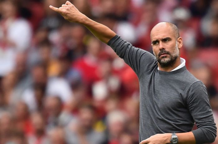  Ekspresi manajer Manchester City, Pep Guardiola, dalam pertandingan pembuka Liga Inggris 2018-2019 menghadapi Arsenal di Stadion Emirates, London, Inggris, pada 12 Agustus 2018. 