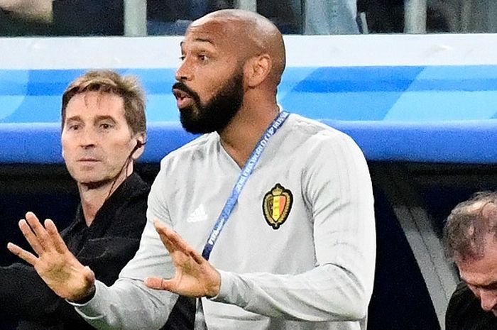  Ekspresi asisten pelatih Belgia, Thierry Henry, dalam laga semifinal Piala Dunia 2018 kontra Prancis di Saint Petersburg Stadium, Saint Petersburg, Rusia pada 10 Juli 2018. 