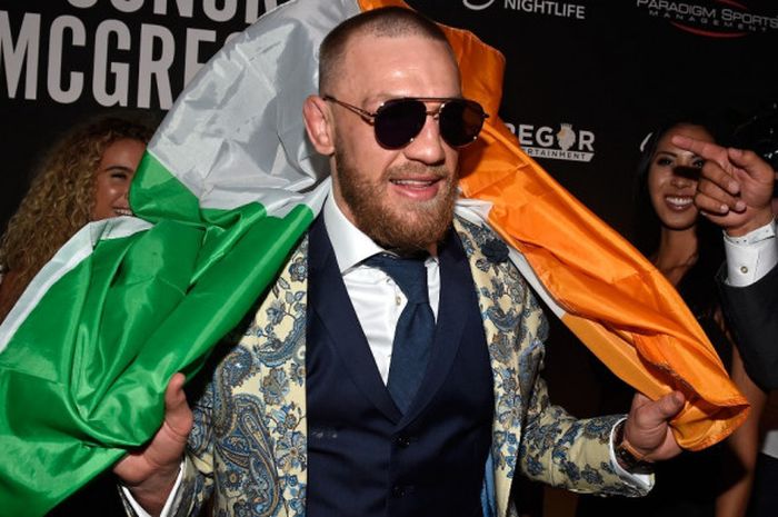 Petarung bebas sekaligus petinju asal Republik Irlandia, Conor McGregor, menghadiri pesta pasca-duel melawan Floyd Mayweather Jr di Encore Beach Club at Night, Wynn, Las Vegas, Nevada, Amerika Serikat, Minggu (27/8/2017).  