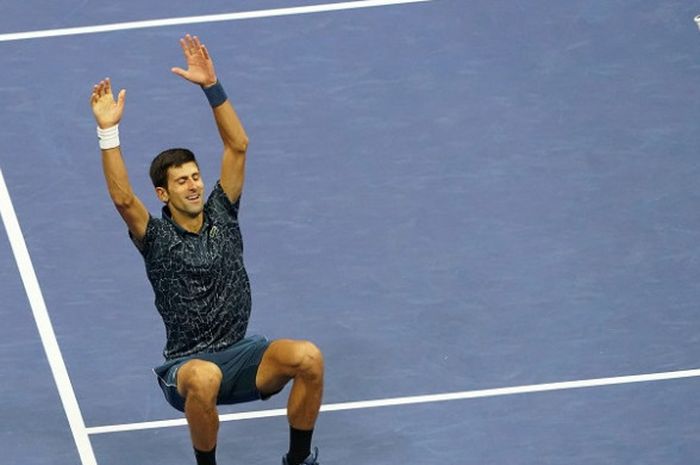 Petenis putra Serbia, Nova Djokovic, bereaksi setelah memastikan kemenangan atas Juan Martin del Potro (Argentina) dengan skor 6-3, 7-6 (4) 7-4, pada final US Open 2018 atau Amerika Serikat (AS) Terbuka di Arthur Ashe Stadium, New York, Amerika Serikat, Minggu (9/9/2018) malam waktu setempat atau Senin (10/9/2018) dini hari WIB.