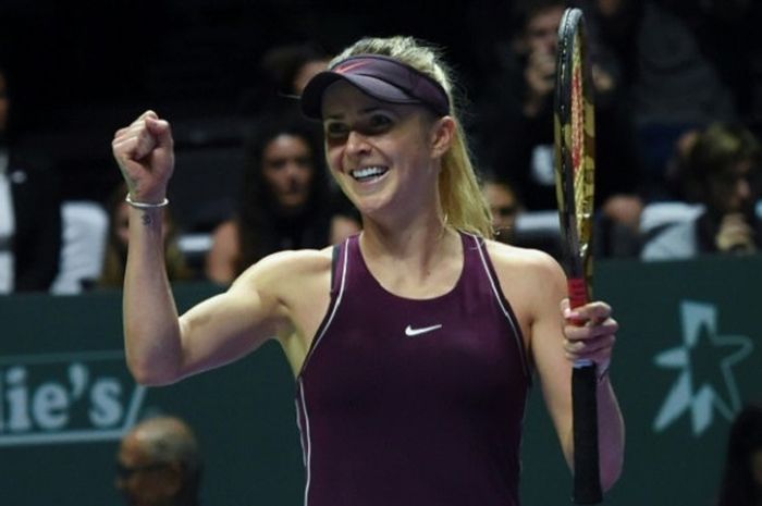 Ekspresi Elina Svitolina (Ukraina) usai mampu mengalahkan Caroline Wozniacki pada laga pamungkas penyisihan Grup Putih WTA Finals 2018 yang berlangsung di Singapore Indoor Stadium, Kamis (25/10/2018).