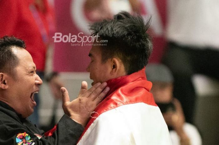 Pesilat Indonesia, Komang Harik Adi Putra, memenangi medali emas melawan Jamari Maj (Malaysia) untuk kelas tarung 65-70kg.