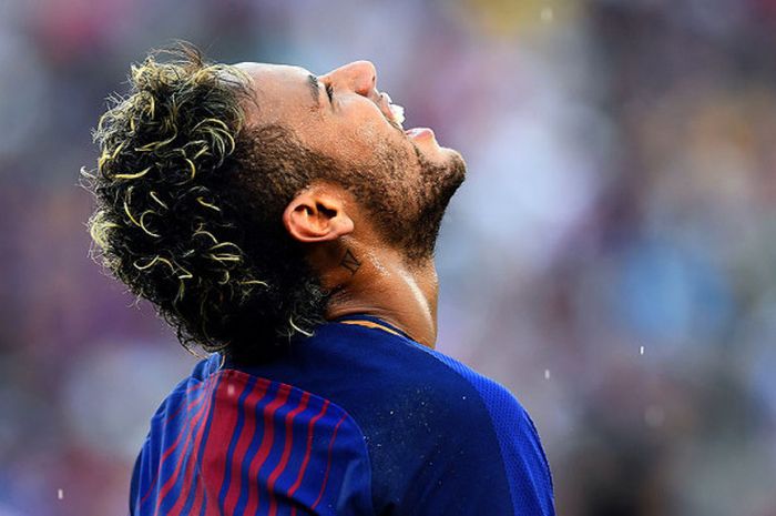 Reaksi stiker Barcelona, Neymar, saat tampil melawan Juventus dalam laga International Champions Cup di Stadion MetLife, East Rutherford, New Jersey, AS, pada 22 Juli 2017.