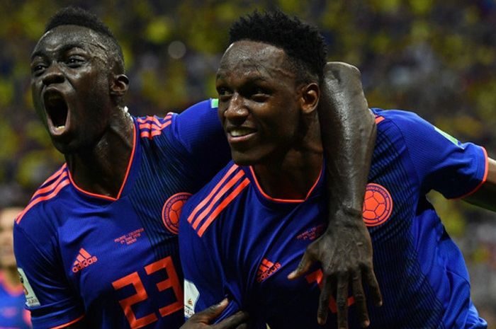   Bek Kolombia, Yerry Mina (kanan), merayakan gol yang dicetak bersama Davinson Sanchez dalam laga Grup H Piala Dunia 2018 kontra Polandia di Kazan Arena, Kazan, Rusia pada 24 Juni 2018.  