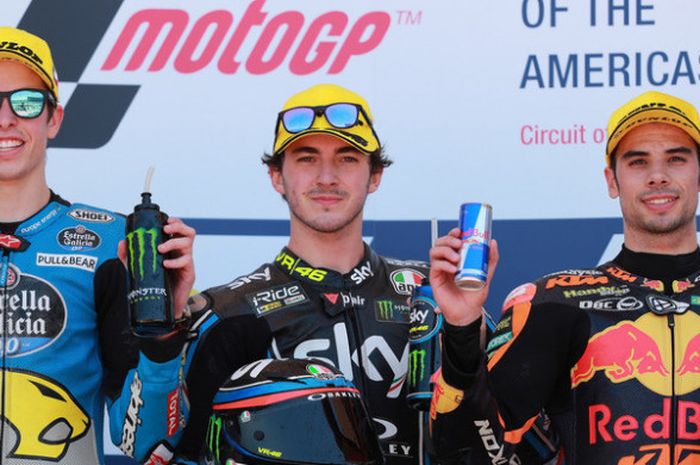 Alex Marquez, Francesco Bagnaia, dan Miguel Oliveira, saat merayakan podium GP Americas 2018.