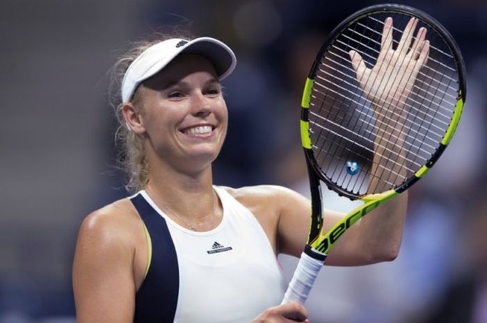 Petenis Denmark, Caroline Wozniacki, merayakan kemenangan atas petenis Latvia, Anastasija Sevastova, pada babak perempat final AS Terbuka di USTA Billie Jean King National Tennis Center, New York, Selasa (6/9/2016).