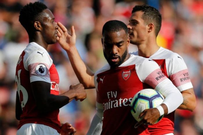 Danny Welbeck (kiri) merayakan gol untuk Arsenal ke gawang West Ham United pada laga Liga Inggris di Stadion Emirates, London, 25 Agustus 2018.