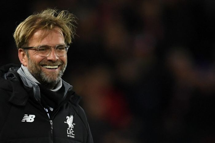 Manajer Liverpool FC, Juergen Klopp, tersenyum seusai laga Grup E Liga Champions kontra Spartak Moskva di Stadion Anfield, Liverpool, Inggris, pada 6 Desember 2017.