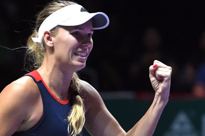 Petenis tunggal putri Denmark, Caroline Wozniacki, melakukan selebrasi saat menjalani laga melawan P