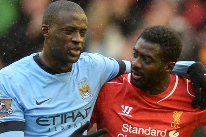 Yaya Toure (kiri) dan kakaknya, Kolo Toure, dalam partai Liga Inggris antara Manchester City dan Liverpool di Stadion Anfield, 1 Maret 2015.