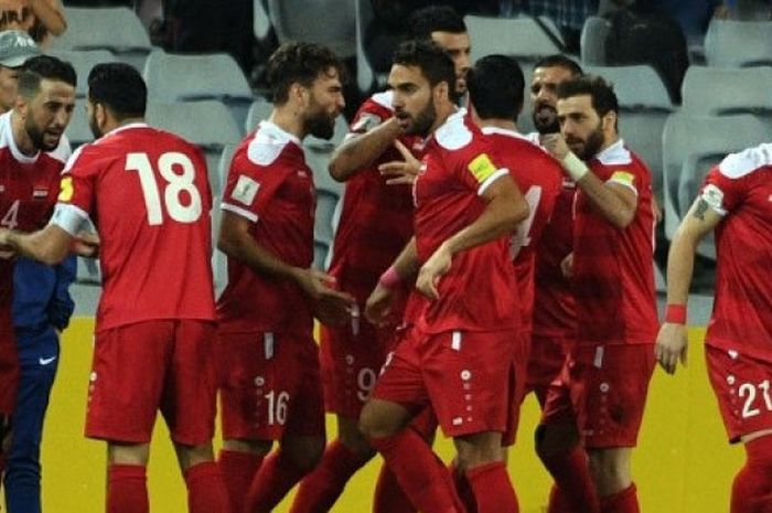 Para pemain timnas Suriah merayakan gol Omar Al Somah dalam laga kontra Australia di Stadion ANZ, Sydney, Selasa (10/10/2017).